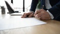 Close up of businessman sign paper contract document