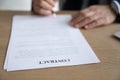 Close up of businessman sign paper contract in office Royalty Free Stock Photo