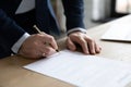 Close up businessman signing contract, making deal, filling legal document Royalty Free Stock Photo