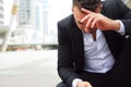 Close up Businessman sitting sadness and thinking work.