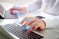 close up of businessman typing digital tablet with keyboard and