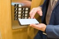 Man hands holding blank screen mobile phone in elevator