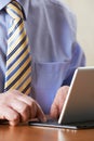 Close Up Of Businessman Using Digital Tablet With Detachable Key