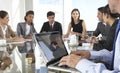 Close Up Of Businessman Using Laptop During Board Meeting Around Royalty Free Stock Photo