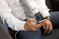 Close up of businessman using mobile smart phone in a car. Royalty Free Stock Photo