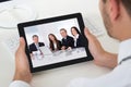 Businessman Videoconferencing With Digital Tablet