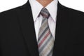 Close-up of businessman wearing black suit with a gray tie, white shirt Royalty Free Stock Photo