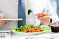 Close-up of businessman working on marketing strategy during business lunch Royalty Free Stock Photo