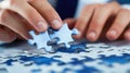 A close-up of a businessmans hands assembling jigsaw puzzle pieces, symbolizing an environmental strategy concept Royalty Free Stock Photo