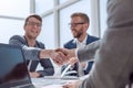 Close up. businessmen confirming the deal with a handshake. Royalty Free Stock Photo