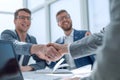 Close up. businessmen confirming the deal with a handshake. Royalty Free Stock Photo