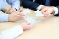 Close-up Of Businessmen Hand Connecting Jigsaw Puzzle