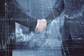 Close up of businessmen handshake with glowing candlestick forex grid chart on blurry office interior background. Financial growth Royalty Free Stock Photo