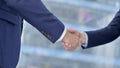 Close-up of Businessmen Shaking there Hands in Modern office