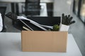 Close-up Of A Businessperson Carrying Cardboard Box During Office Meeting Royalty Free Stock Photo