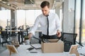 Close-up Of A Businessperson Carrying Cardboard Box During Office Meeting Royalty Free Stock Photo