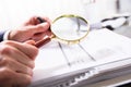 Businessperson Checking Bill With Magnifying Glass Royalty Free Stock Photo