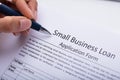 Businessperson Filling Small Business Loan Application Form Royalty Free Stock Photo