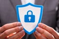 Businessperson Holding Shield Security Icon