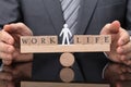 Businessperson Protecting Balance Between Life And Work Royalty Free Stock Photo