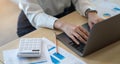 Close up of businesswoman or accountant hand holding pencil working on calculator to calculate financial data report, accountancy Royalty Free Stock Photo