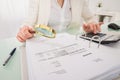 Close-up Of Businesswoman Checking Bill With Magnifying Glass Royalty Free Stock Photo