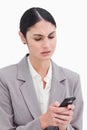 Close up of businesswoman confused by text message