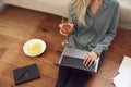 Close Up Of Businesswoman At End Of Day With Wine In Loungewear And Suit On Laptop Working At Home Royalty Free Stock Photo