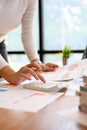 Close-up, businesswoman or female financial worker using a calculator Royalty Free Stock Photo