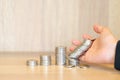 Close up of businesswoman hands with stack coins - stock and mar Royalty Free Stock Photo