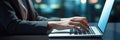 Close up of businesswoman hands typing on laptop keyboard in office Royalty Free Stock Photo