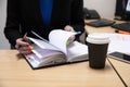 Close-up Of A Businesswoman Making Agenda On Personal Organizer At Workplace Royalty Free Stock Photo