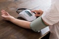 Close-up Of Businesswoman Measuring Blood Pressure