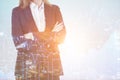 Close up of a businesswoman standing with arms crossed near grap Royalty Free Stock Photo