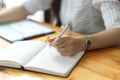 Close up, Businesswoman writing on notebook, taking notes, organising agenda Royalty Free Stock Photo