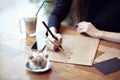 Close-up busyness concept. Stationary layouts. Wooden table in a cafe Royalty Free Stock Photo