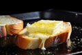 close-up of butter melting on hot garlic bread