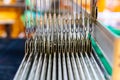 Close Up Cable Sling of Weaving Machine and Thai traditional Silk. Weaving loom for homemade Silk textile. Royalty Free Stock Photo