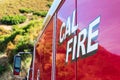 Close up. CAL FIRE sign on engine truck of California Department of Forestry and Fire Protection parked outdoors on mountain road