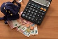 Close-up of a calculator, euro bills and diy facemask, designed as an Europian Union flag. Royalty Free Stock Photo