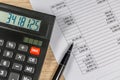 Calculator and pen lie on the finance document Royalty Free Stock Photo