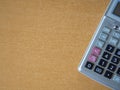 Close-up of a calculator on a wooden table with space for text Royalty Free Stock Photo