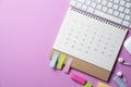 Calendar and computer keyboard on the pink table background, planning for business meeting or travel planning concept Royalty Free Stock Photo