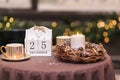 Close up Calendar with date 25 December. Coffee table with two cups of hot coffee, chocolate and decorative composition with Royalty Free Stock Photo