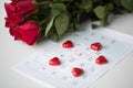 Close up of calendar, heart, candies and red roses Royalty Free Stock Photo