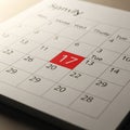 Close-up of a calendar page displayed on a table. It features a month grid with the Royalty Free Stock Photo