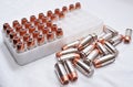 A close up of .40 caliber bullets, some in and some out of plastic shell container Royalty Free Stock Photo