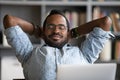 Close up calm African American businessman relaxing daydreaming at workplace Royalty Free Stock Photo