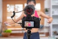 Close up at camera while asian woman blogger recording a video tutorial how to loose weight and get healthy. Influencer lifestyle