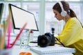 Close-up of camera on desk with executive working at office Royalty Free Stock Photo